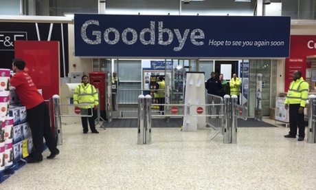 Staff members stand near the exit during a very quiet 