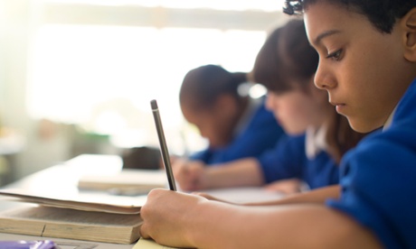 Children writing in a primary classroom