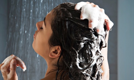 woman in shower washing hair