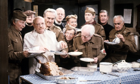 Captain Mainwaring serving food to members of Dad’s Army