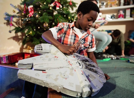 Babafewa Akinsammi, aged seven, plays with the  Millennium Falcon.