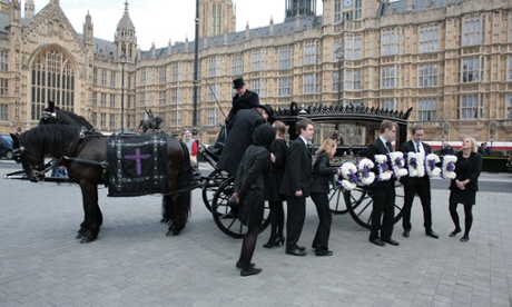 Is the UK science system about to receive a mortal blow? Scientists in a May 2012 protest deliver a petition in a coffin.