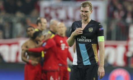 Per Mertesacker contemplates life as Bayern Munich celebrate their win over Arsenal in the Champions League.