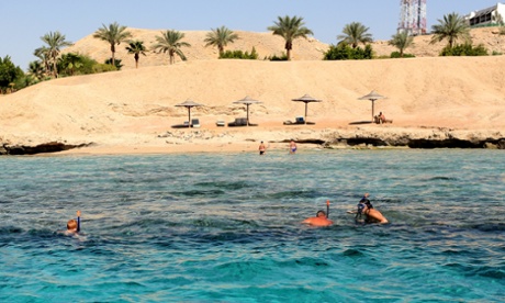 Tourists snorkel at Sharm el-Sheikh on Monday