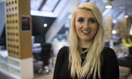 Maddie Bruce smiles at the camera, with heavy make-up and long blond hair