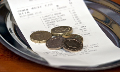 A tip left on a dish at a restaurant