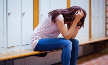Sad student on a bench