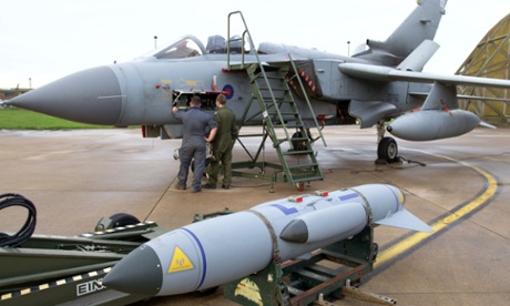 Pilots and ground crew prepare a Tornado GR4 aircraft at the British Royal Air Force airbase RAF Marham in Norfolk in east England on December 2, 2015. Two more Tornado fighters from RAF Marham and six Typhoon jets from RAF Lossiemouth set off December 3 to join aircraft already operating out of RAF Akrotiri in Cyprus.