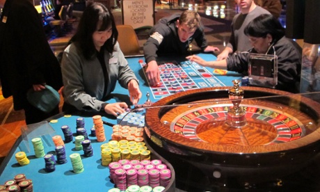 In this April 17, 2015 photo, a dealer counts chips during a game of roulette at the Tropicana Casino and Resort in Atlantic City, N.J.
