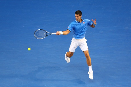 Novak Djokovic plays a forehand.
