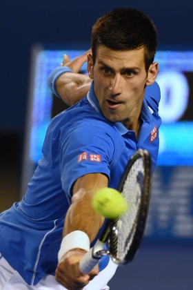 Novak Djokovic hits a return.