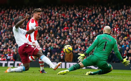 Olivier Giroud scores past Aston Villa's Brad Guzan.