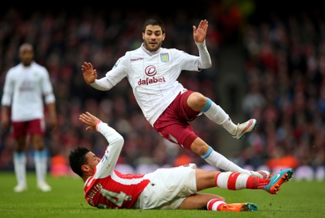 Carles Gil is tackled by Francis Coquelin.