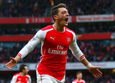 Mesut Ozil celebrates.