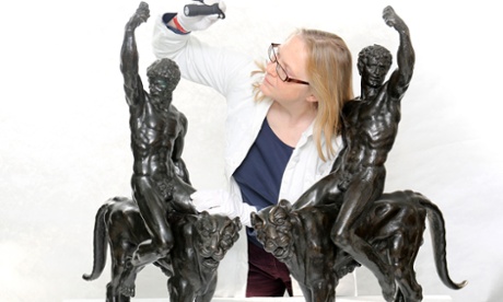 Victoria Avery, keeper of applied arts at the Fitzwilliam Museum, examines the two bronze sculptures thought to be by Michelangelo.