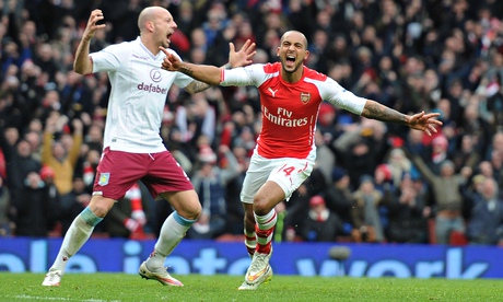 Theo Walcott celebrates his goal against Aston Villa on the occasion of his first Premier League sta