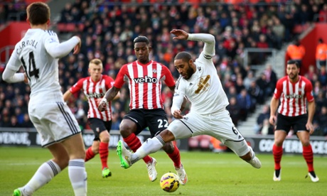 Swansea City's Ashley Williams tries to keep the ball from Southampton's Eljero Elia in somewhat unconventional style.