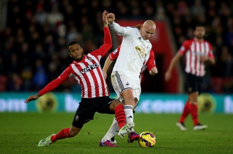 Jonjo Shelvey holds off the challenge from Ryan Bertrand.