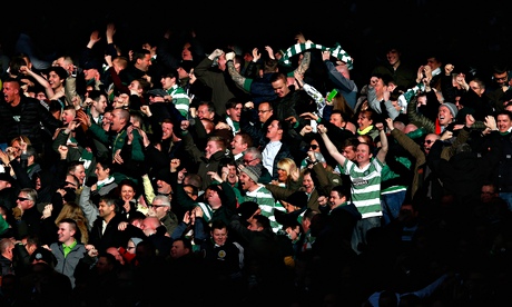 Celtic fans celebrate during the Scottish League Cup semi-final against Rangers at Hampden Park.