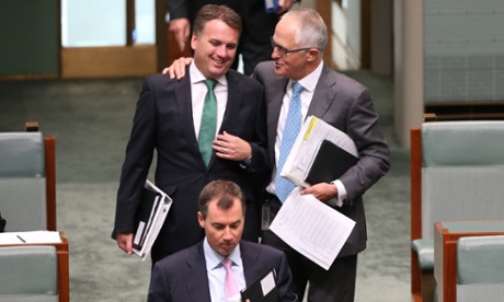 Minister for Communications Malcolm Turnbull gives the love to Assistant Infrastructure Minister Jamie Briggs as they arrive for question time in the House of Representatives this afternoon, Tuesday 10th February 2015.