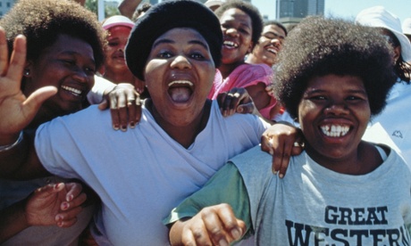 Crowds celebrate in Cape Town following the release of Nelson Mandela from prison on 11 February 1990.
