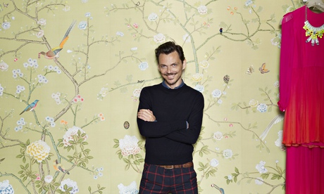 Matthew Williamson with folded arms, grinning