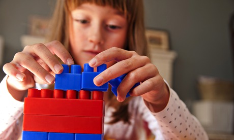 Girl playing with building blocks