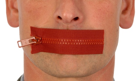 man with zip across mouth