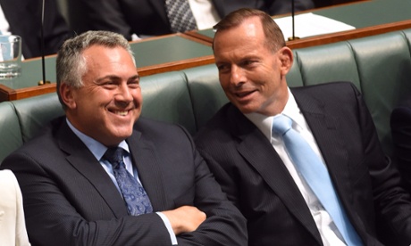 Federal Treasurer Joe Hockey (L) and Prime Minister Tony Abbott speak during Question Time at Parliament House in Canberra,