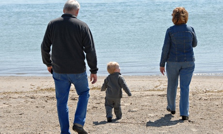 Grandparents with their grandson at the beach