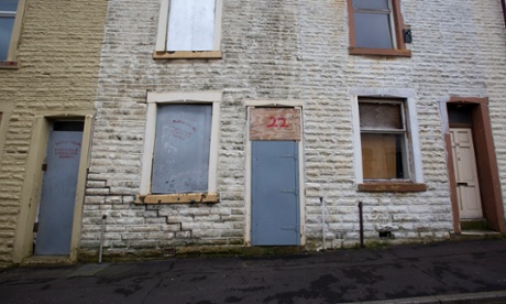 Boarded up empty house
