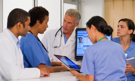 Doctors and nurses at a computer