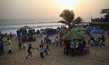 Children play on the beach in Monrovia, Liberia. With Ebola cases now in single digits nationwide, many Liberians have begun to return to normal life.
