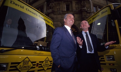 Mutiny on the buses? Davids Owen and Steel with their almost-matching campaign vehicles.