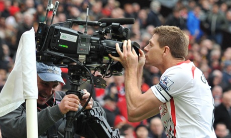 Liverpool footballer Steven Gerrard kissing a camera