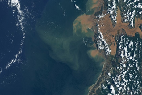 A tropical disturbance that had already swamped southern Africa with rain strengthened into a tropical storm as it passed over the Mozambique Channel on January 15, 2015.