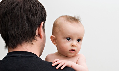 Father holding baby son
