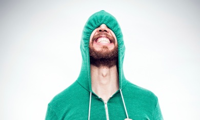 See no evil: a young person (possibly) pulls down his hood and hopes the politicians leave him alone.