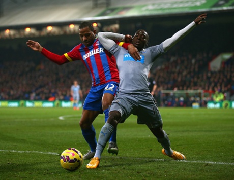 Jason Puncheon of Crystal Palace and Massadio Haidara of Newcastle United tussle for the ball at Selhurst Park.
