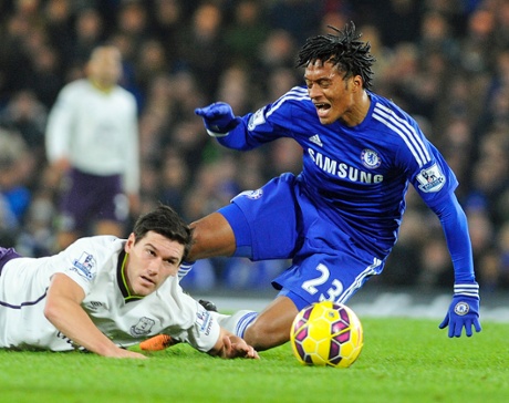 Chelsea's Juan Cuadrado tumbles to the turf courtesy of an 