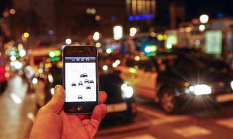 A person uses the Uber app in Barcelona