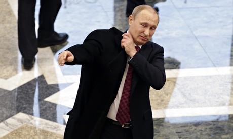 The Russian president, Vladimir Putin, leaves the Ukrainian peace negotiations in Minsk