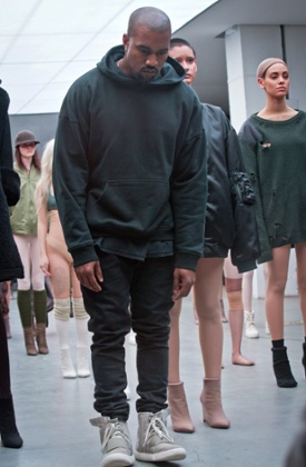 Kanye West appears with models during the  showing of the Kanye West Adidas Fall 2015 collection at Fashion Week.