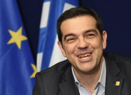 Greek Prime Minister Alexis Tsipras smiles during a press conference during the European Council Summit.
