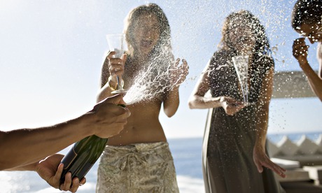 People on a yacht with champagne