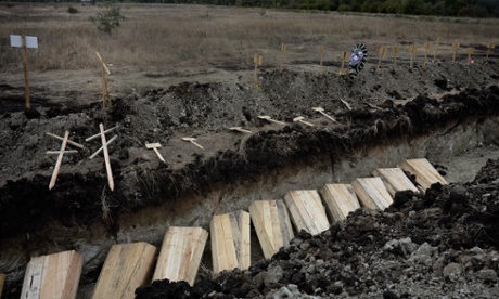 A mass grave on the outskirts of Luhansk, for victims of mortar and shelling attacks.