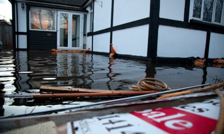 The sort of conditiona that local authorities need to be prepared for: property flooded by the river Thames a year ago.