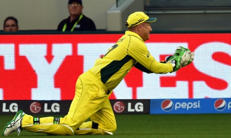 Brad Haddin dives to catch Joe Root.