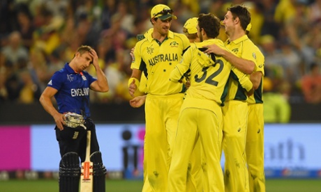 James Taylor of England looks on as Australia celebrate their win.