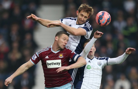 Kevin Nolan battles West Brom's Gareth McAuley and Craig Gardner.